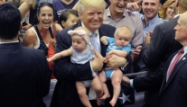 US Republican Presidential Candidate Donald Trump holds two babies after his Town Hall address at the Gallogly Events Center in Colorado Springs, Colorado, on July 29, 2016. / AFP / Jason Connolly (Photo credit should read JASON CONNOLLY/AFP/Getty Images)